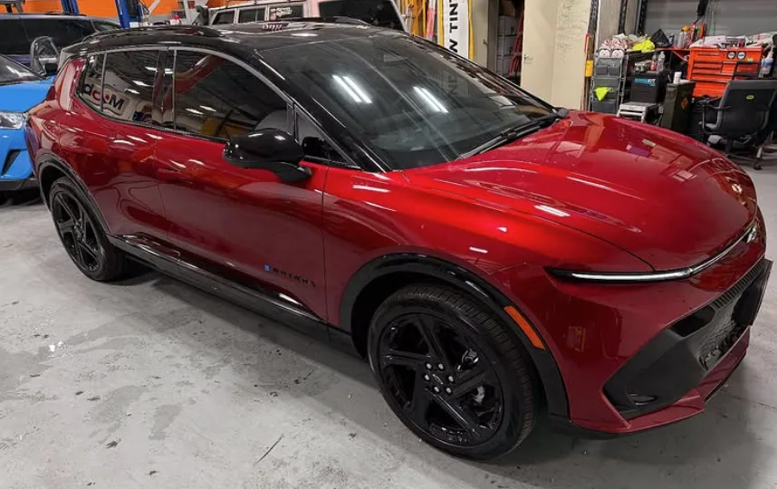 Red Chevy Blazer EV with freshly installed window tint at NY Window Tinting